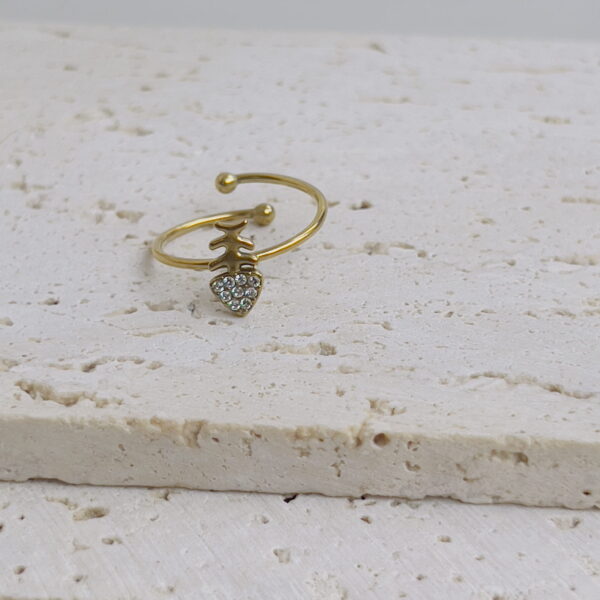 Tiny white arrow ring